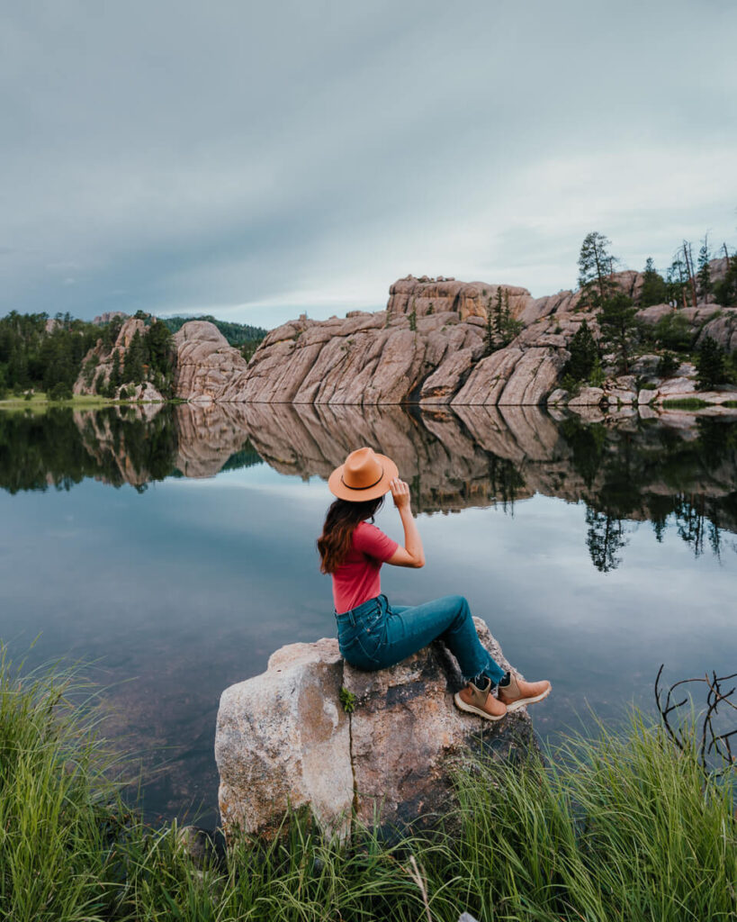 Woman looking out across Sylvan Lake at Custer State Park in South Dakota