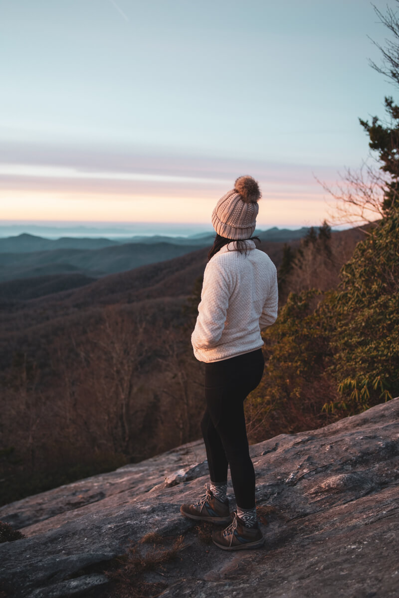 Woman admiring the sunrise over the Blue Ridge Mountains