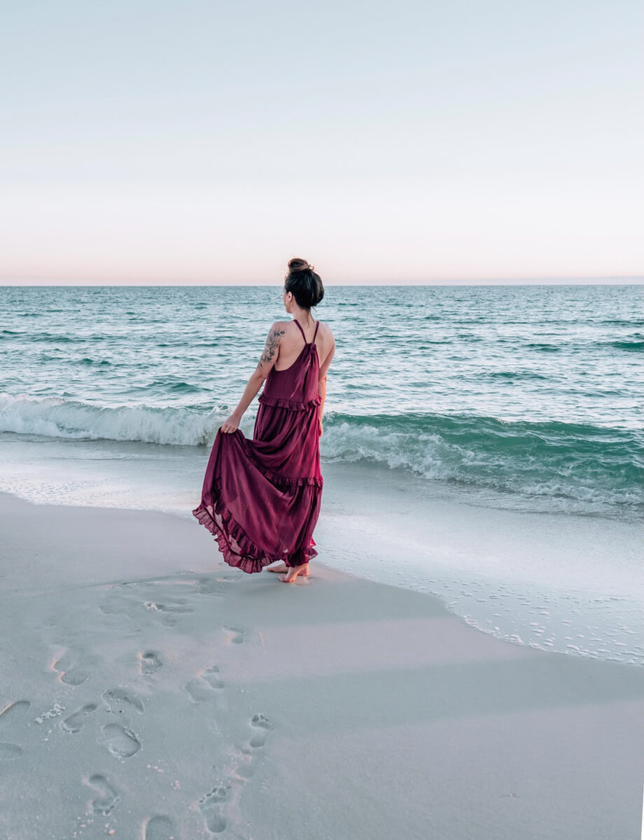 Woman in a dress on the beach in Panama City Beach, FL