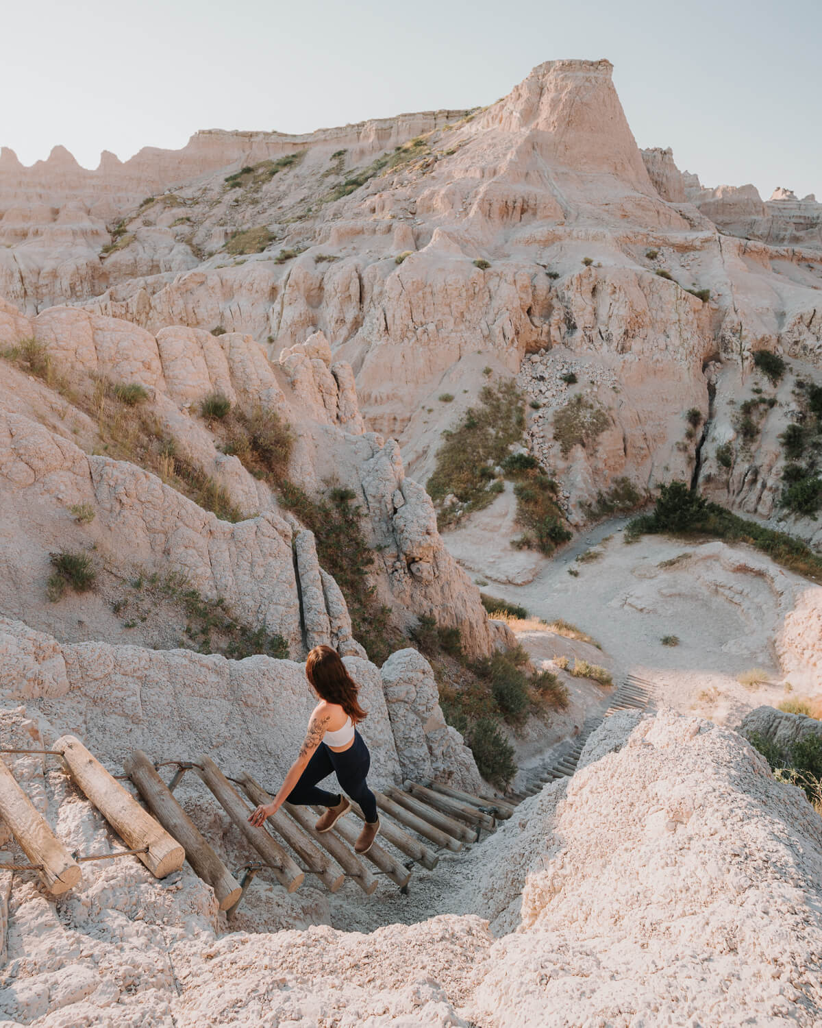 Woman hiking the Notch Trail in Badlands National Park