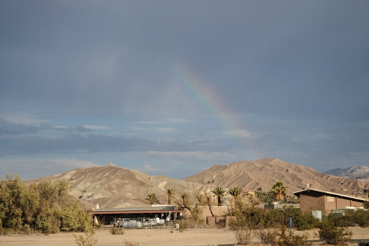 Campground in Death Valley National Park with rainbow in the background