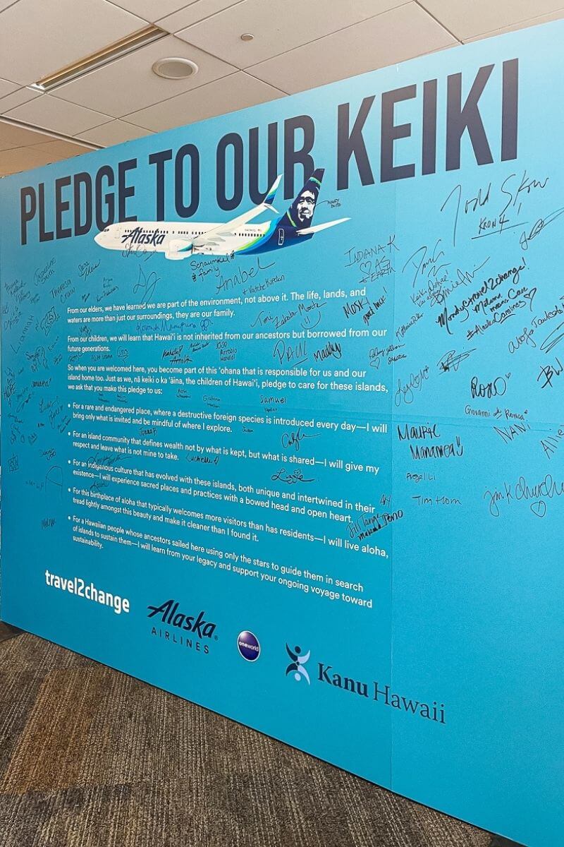 Blue poster of the Pledge to Our Keiki with signatures 