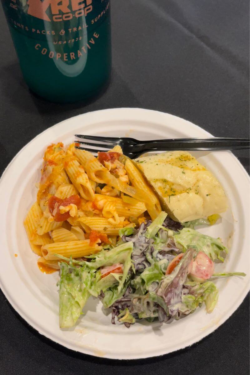 Dinner plate with bread, pasta, and salad