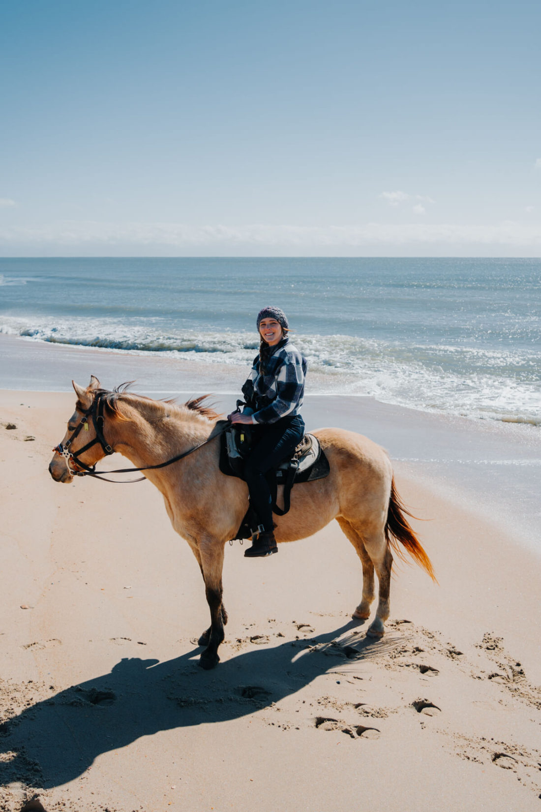 Woman horseback riding on the Outer Banks
